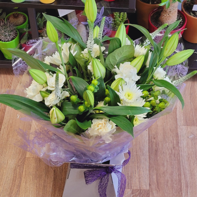 Evelyn - A fabulous collection of white and cream flowers make this the perfect gift. This bouquet will be hand delivered by the local florist.