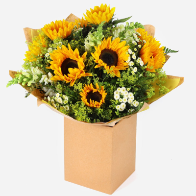 Sunshine Splendour - Radiate joy and warmth with this cheerful bouquet of sunflowers and lush greenery. Presented in a beautiful packaging, it’s perfect for bringing a touch of sunshine into any space.
